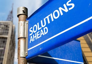Solutions Ahead blue road sign